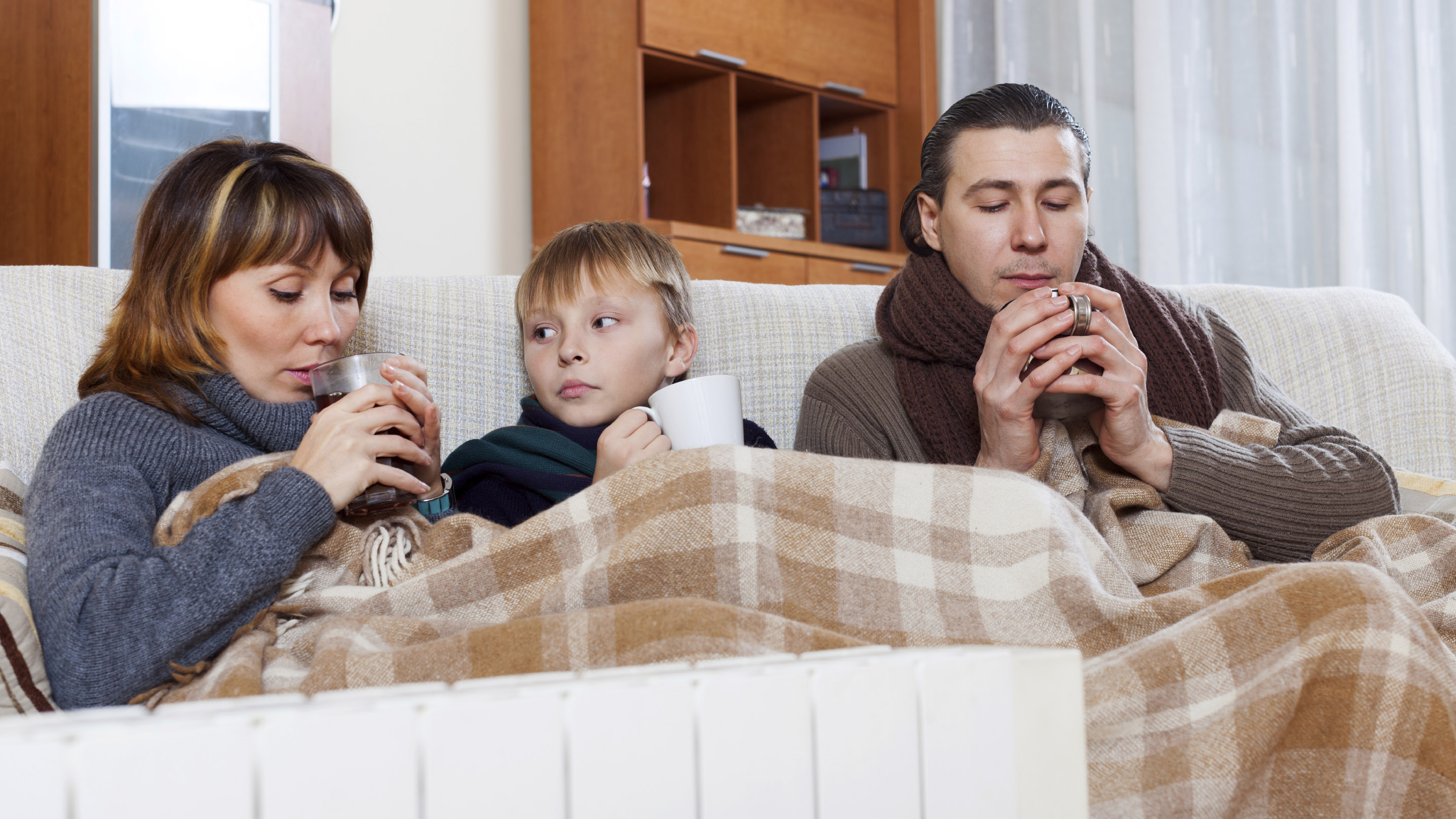 Cold family in house iStock 000033106944 Large